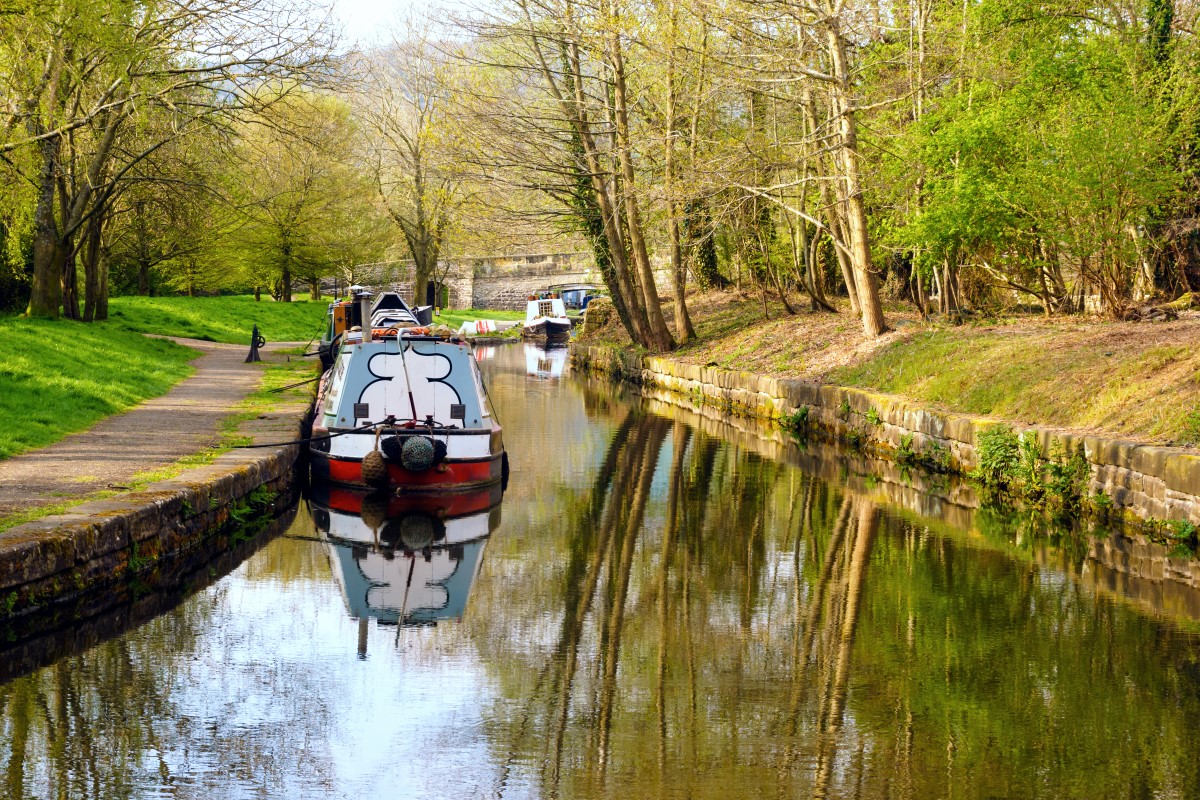 Narrowboats moored up on the Llangollen canal in the Trevor Basin at the aqueduct